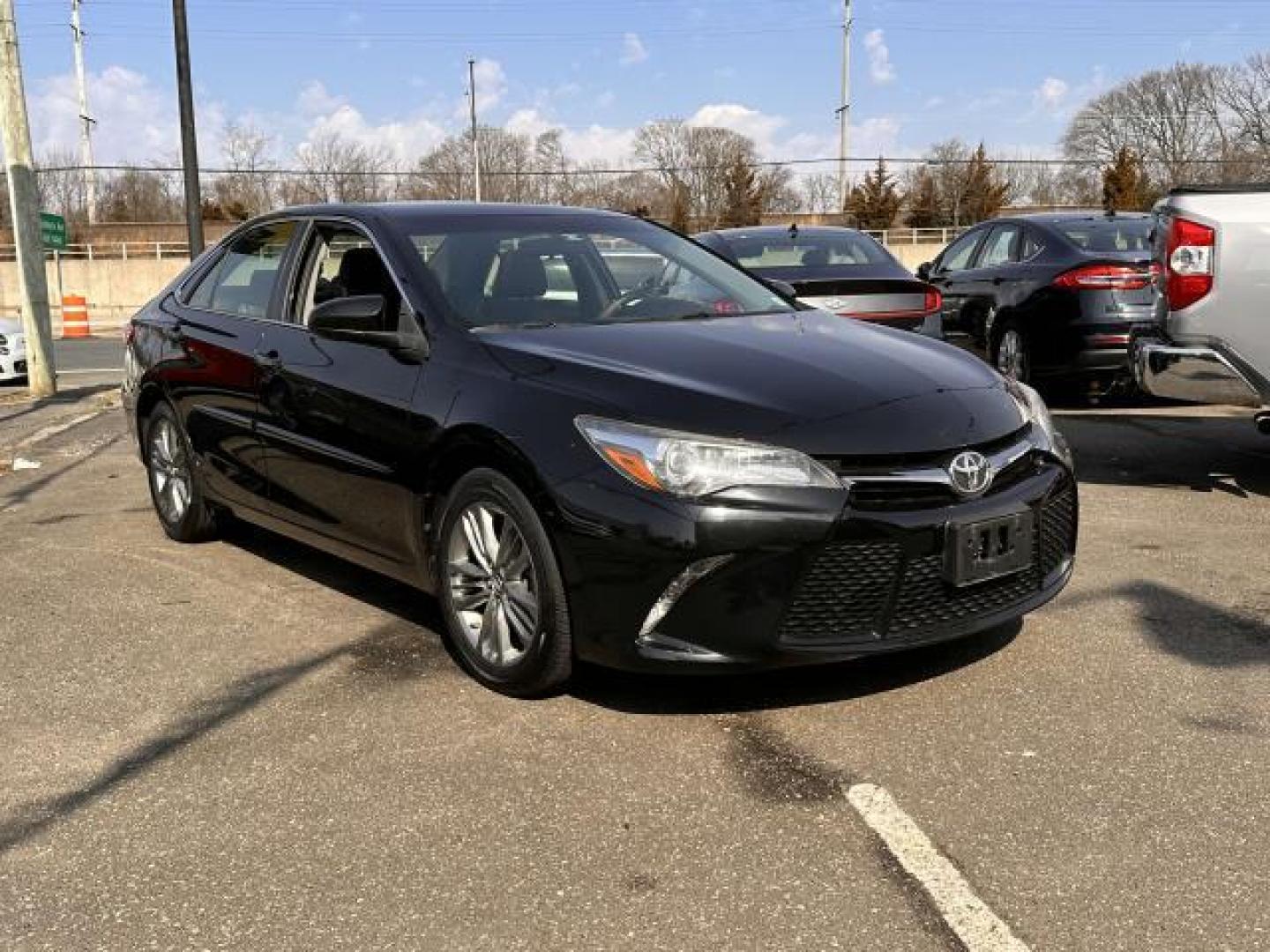 2017 Midnight Black Metallic /Black Toyota Camry SE Auto (Natl) (4T1BF1FK7HU) , Automatic transmission, located at 1696 Sunrise Hwy, Bay Shore, NY, 11706, (516) 557-0557, 40.733665, -73.256317 - Designed to deliver superior performance and driving enjoyment, this 2017 Toyota Camry is ready for you to drive home. This Camry has been driven with care for 64720 miles. Buy with confidence knowing you're getting the best price and the best service. Experience it for yourself now. All internet p - Photo#0