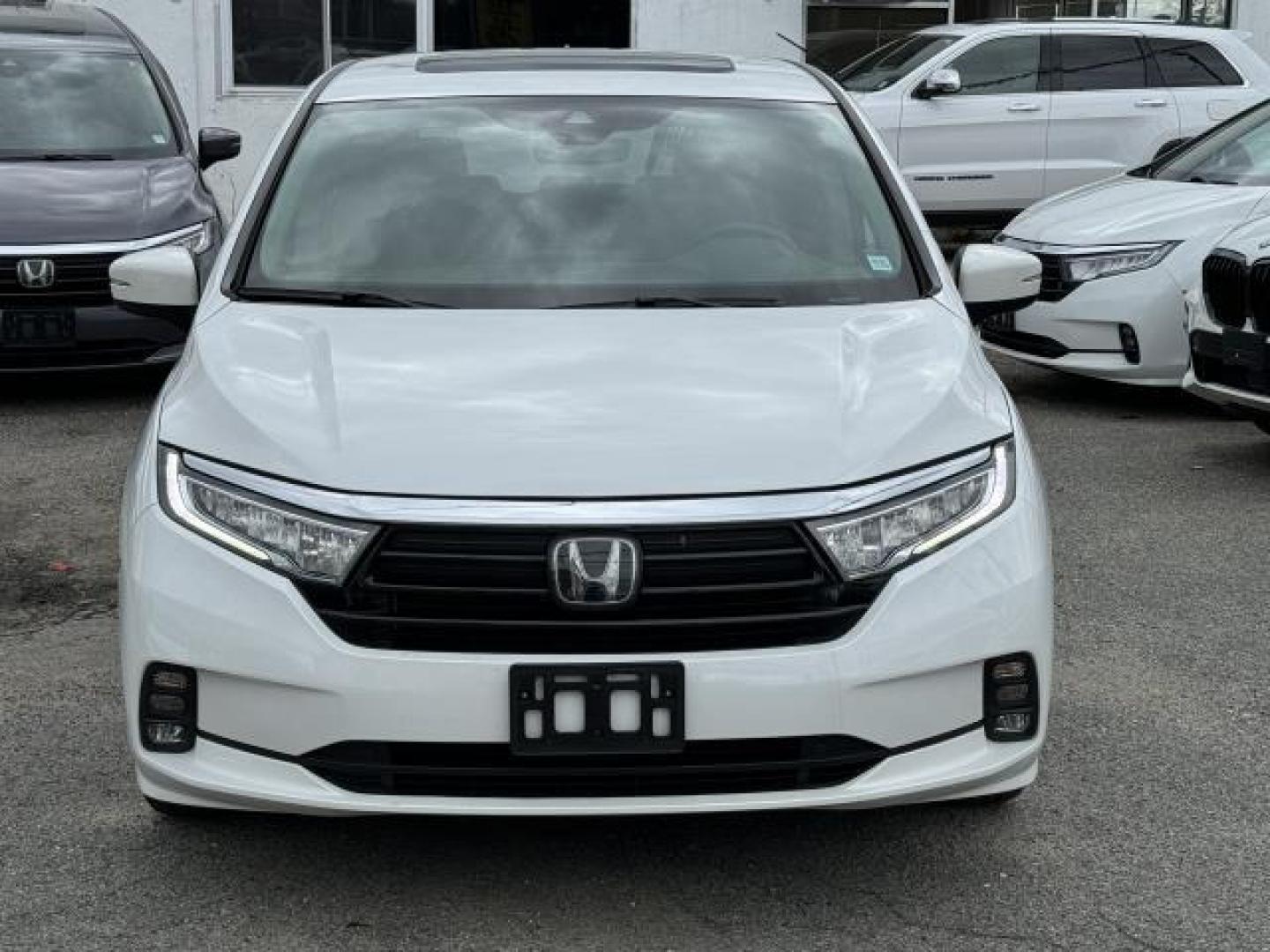 2021 Platinum White Pearl /Black Honda Odyssey EX-L Auto (5FNRL6H73MB) , Automatic transmission, located at 1696 Sunrise Hwy, Bay Shore, NY, 11706, (516) 557-0557, 40.733665, -73.256317 - This 2021 Honda Odyssey is in great mechanical and physical condition. This Odyssey has 22545 miles, and it has plenty more to go with you behind the wheel. We won't sell you a vehicle that we wouldn't sell our family. Stop by the showroom for a test drive; your dream car is waiting! All internet p - Photo#2