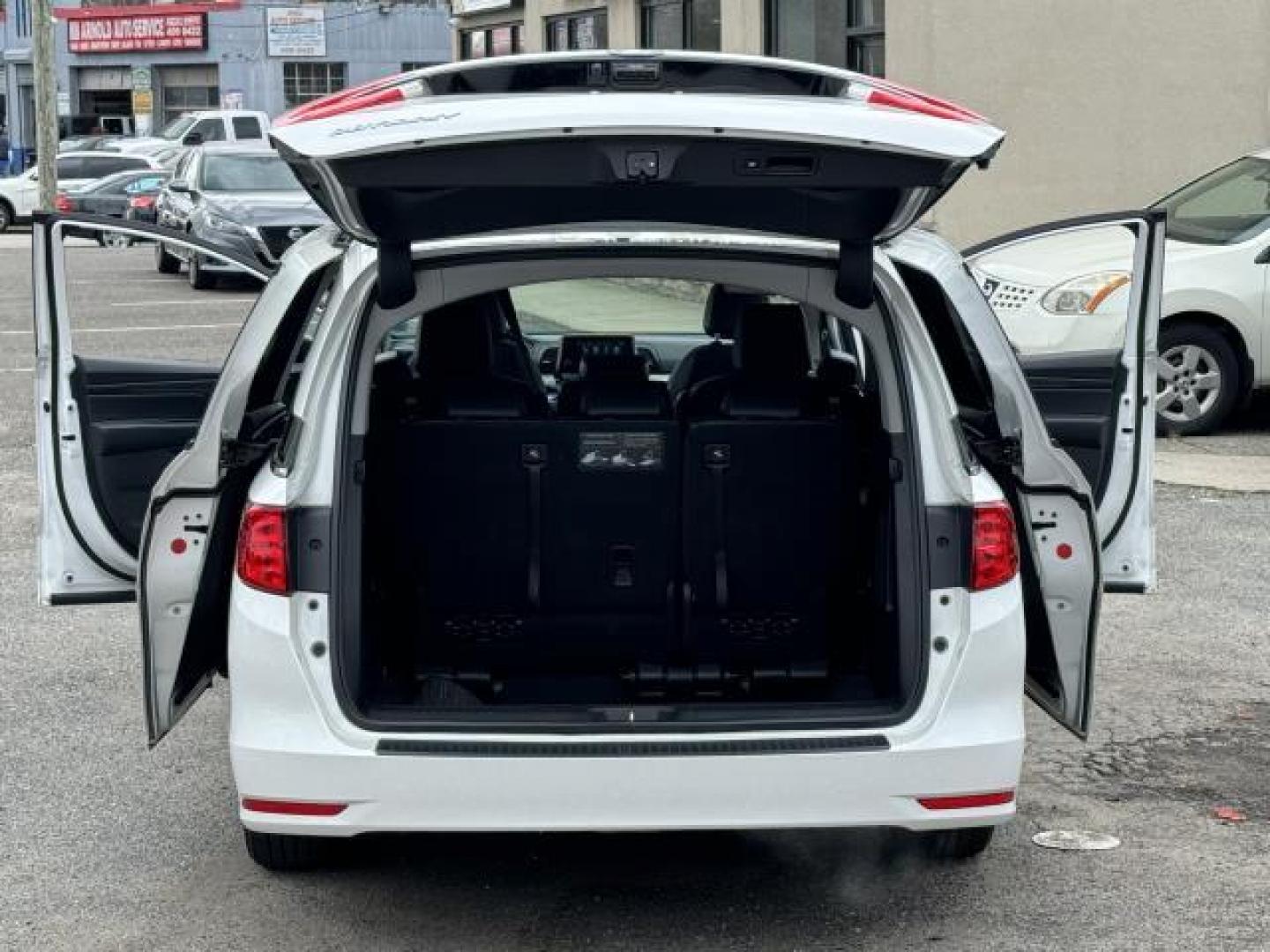 2021 Platinum White Pearl /Black Honda Odyssey EX-L Auto (5FNRL6H73MB) , Automatic transmission, located at 1696 Sunrise Hwy, Bay Shore, NY, 11706, (516) 557-0557, 40.733665, -73.256317 - This 2021 Honda Odyssey is in great mechanical and physical condition. This Odyssey has 22545 miles, and it has plenty more to go with you behind the wheel. We won't sell you a vehicle that we wouldn't sell our family. Stop by the showroom for a test drive; your dream car is waiting! All internet p - Photo#46