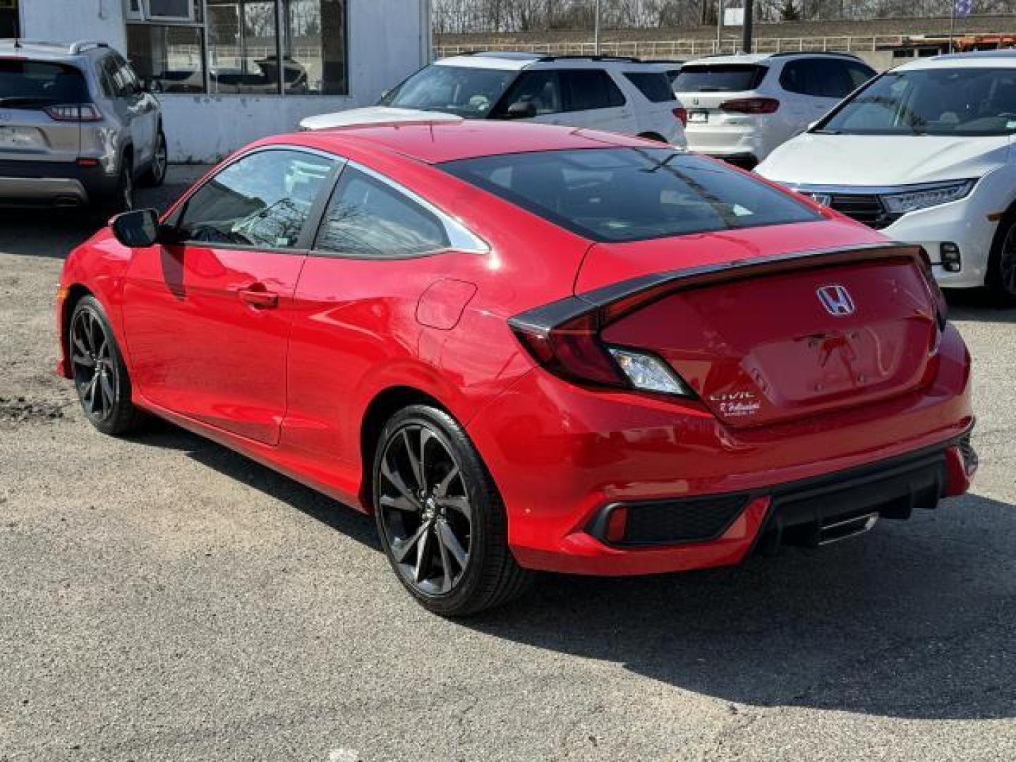 2019 Rallye Red /Black Honda Civic Coupe Sport CVT (2HGFC4B89KH) , Automatic transmission, located at 1696 Sunrise Hwy, Bay Shore, NY, 11706, (516) 557-0557, 40.733665, -73.256317 - We are overstocked and making deals on models such as this 2019 Honda Civic Coupe. This Civic Coupe has been driven with care for 16052 miles. You'll always feel welcome at Auto Connection. If you're ready to make this your next vehicle, contact us to get pre-approved now. All internet purchases in - Photo#2